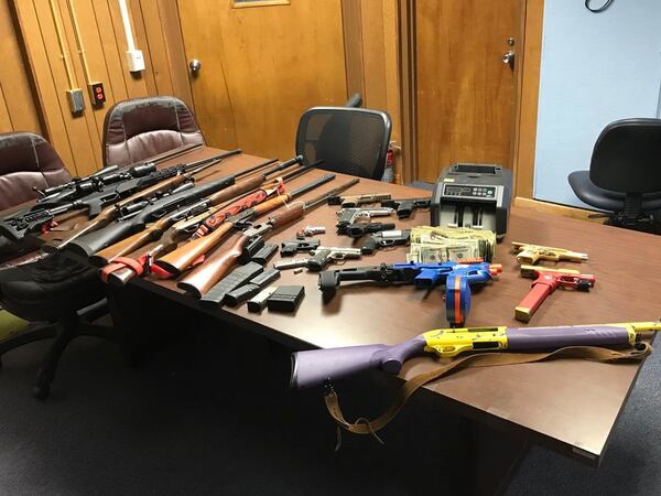 A drug raid in North Carolina turned up narcotics, cash and plenty of guns, including a Glock 19 semiautomatic pistol disguised as a toy Nerf gun. (Image: Catawba County NC Sheriff's Office)