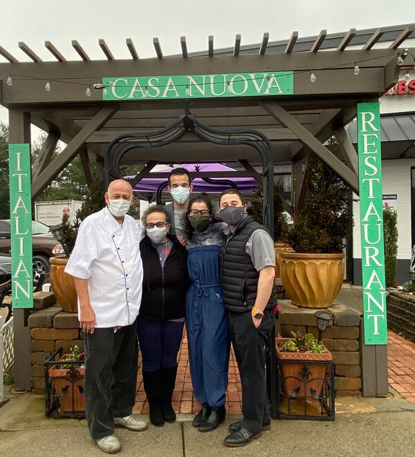 Antonio Fundora (from left) and wife Maria are seen with their three children, Alex, Cari and Jose, aka Pepe. The children help with the family business, Casa Nuova Italian restaurant, which opened in Alpharetta in 1998. Ligaya Figueras/ligaya.figueras@ajc.com