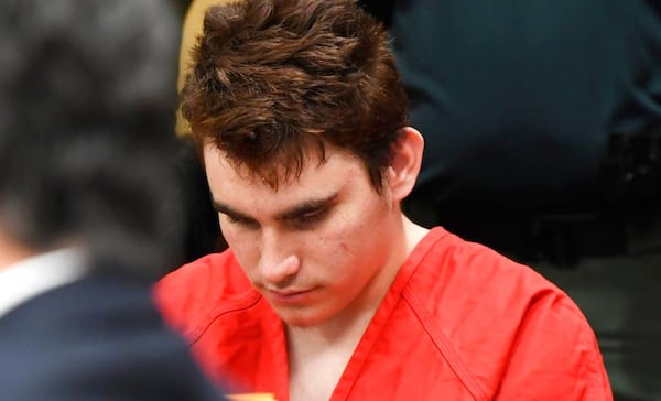 Nikolas Cruz listens to a hearing in his case at the Broward Courthouse in Fort Lauderdale, Fla., Wednesday, April 11, 2018. The hearing  was to determine if Cruz should continue to have a lawyer at taxpayer expense.  Cruz is charged with killing 17 people and wounding 17 others at Marjory Stoneman Douglas High School in the Feb. 14 mass shooting.  (Taimy Alvarez/South Florida Sun-Sentinel via AP, Pool)