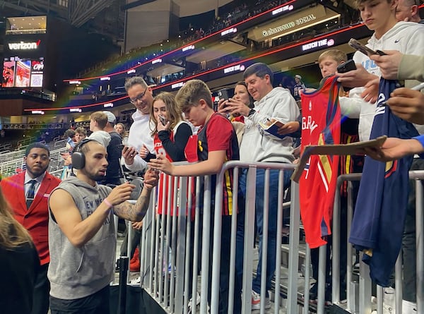 New Orleans Pelicans guard Jose Alvarado signs autographs prior to his team's game against the Hawks at State Farm Arena March 10, 2024. Having starred at Georgia Tech and having made a name for himself in the NBA, Alvarado's signature was in demand from fans, which he accommodated. (AJC photo by Ken Sugiura)