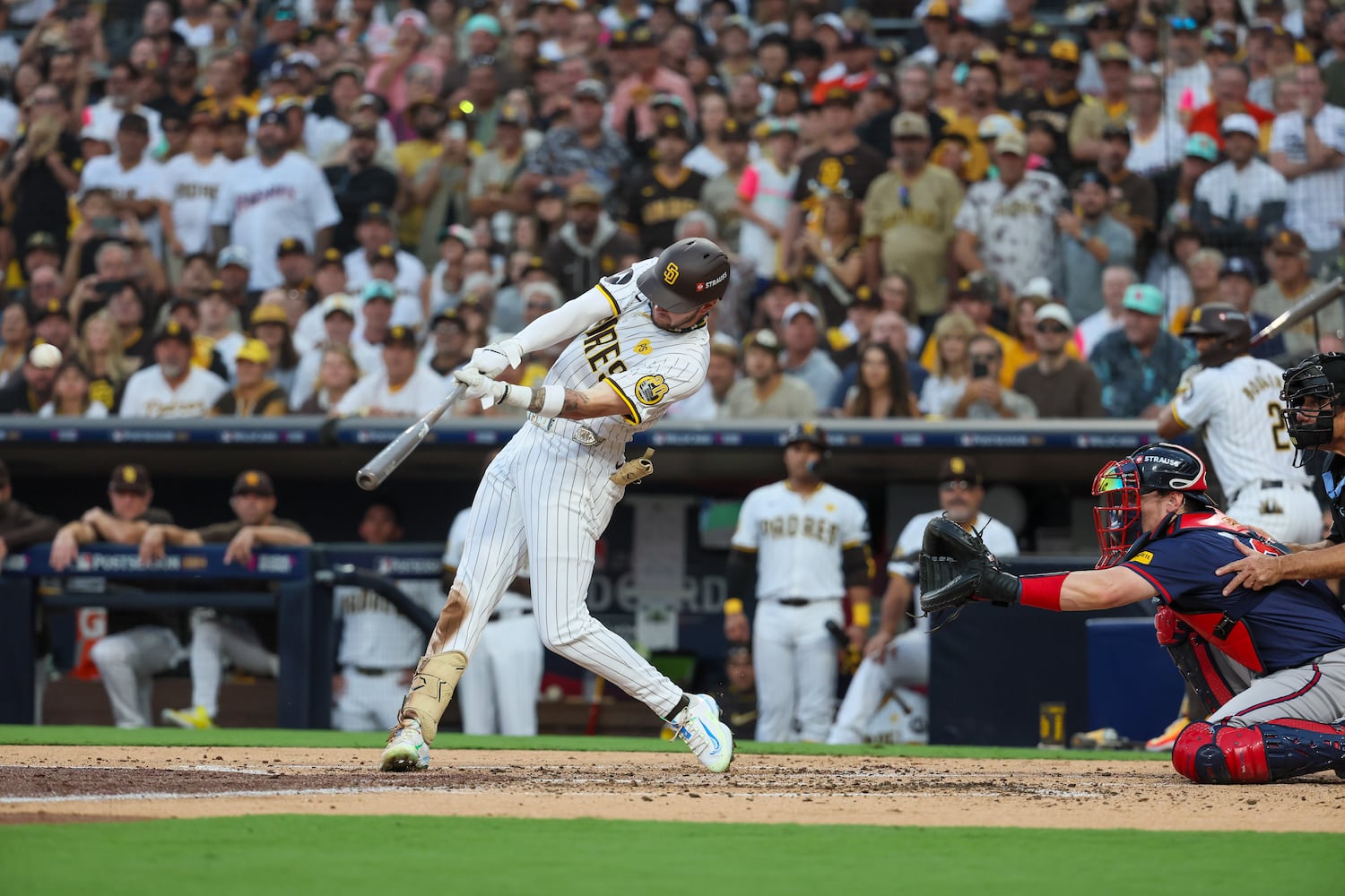 San Diego Padres outfielder Jackson Merrill triples against the Atlanta Braves to score two runs during the second inning of National League Division Series Wild Card Game Two at Petco Park in San Diego on Wednesday, Oct. 2, 2024.   (Jason Getz / Jason.Getz@ajc.com)