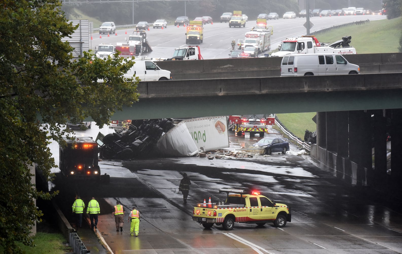 I-285 crash: Trucks plunge off interstate onto Ga. 400