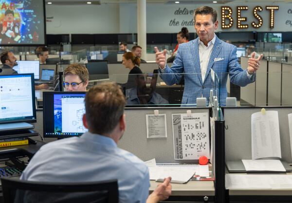 Pat Flood interacts with associates at Supreme Lending in Alpharetta for the Top Workplace in the midsize category. PHIL SKINNER FOR THE ATLANTA JOURNAL-CONSTITUTION