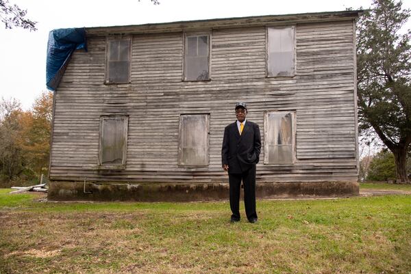 Myers stands outside the Chickamauga Masonic Lodge, which community members hope will become active again once the building is repaired.  Contributed by Mark Gilliland