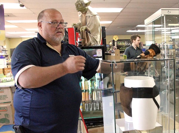 In May 2018, Blockbuster general manager Kevin Daymude moves a display case featuring the jockstrap worn by actor Russell Crowe in the 2005 movie "Cinderella Man" at a Blockbuster video store in Anchorage, Alaska. Despite the gift from HBO's John Oliver, Daymude said the last two Blockbuster Video locations in Alaska will rent their last video on Sunday, July 15, 2018.