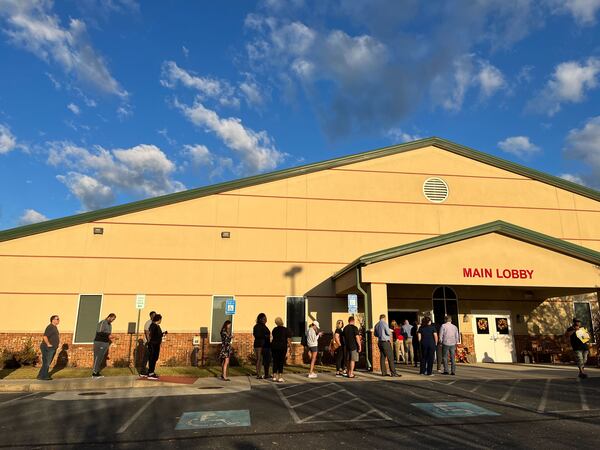 Voters line up Tuesday morning at a polling spot at Hamilton Mill Christian Church in the Buford area of Gwinnett County.