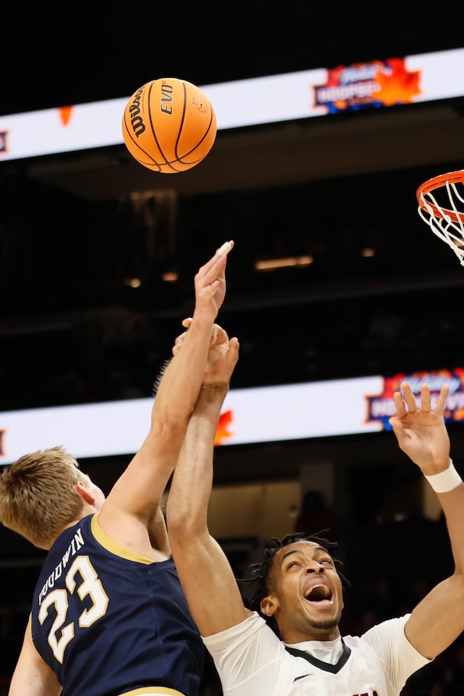 Bulldogs center Frank Anselem goes up for a rebound against Fighting Irish guard Dane Goodwin during the first half Sunday night at State Farm Arena. (Miguel Martinez / miguel.martinezjimenez@ajc.com)