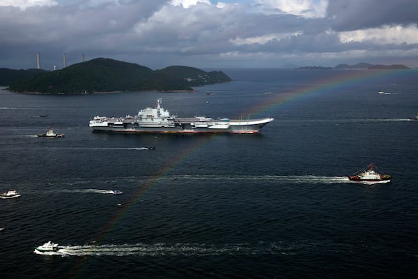 FILE- The Liaoning, China's first conventionally powered aircraft carrier, sails into Hong Kong for port call, on July 7, 2017, to celebrate the 20th anniversary of the People's Liberation Army (PLA) garrison's presence in the semi-autonomous Chinese city and former British colony. (AP Photo/Kin Cheung, File)