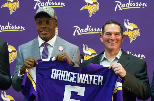 Teddy Bridgewater and Mike Zimmer on draft day. (Associated Press)