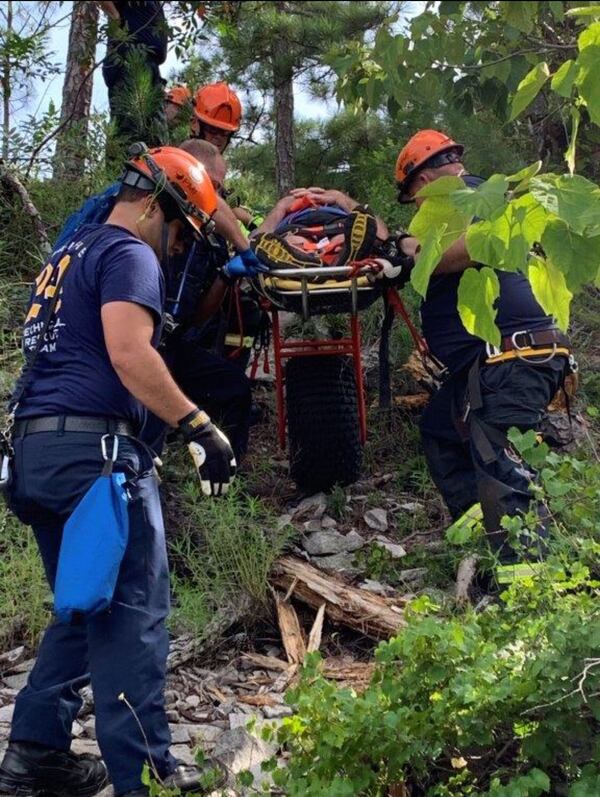 The crew mounted the hiker onto a wheel and rolled him to safety.