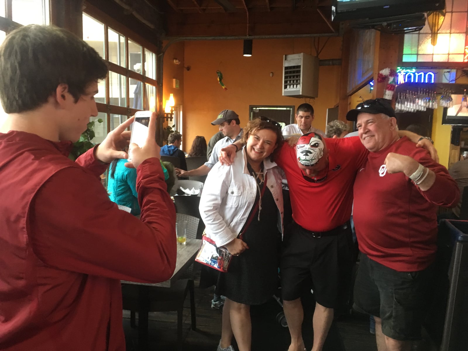  These folks are Oklahoma fans but they all wanted photos with Trent "Big Dawg III" Woods! Photo: Jennifer Brett