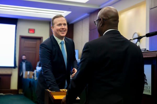 Brian Jack (left) participated in the House of Representatives’ lottery for offices for new members at the U.S. Capitol in Washington on Thursday.