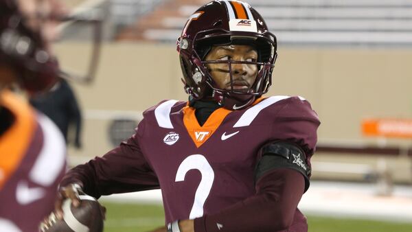 Virginia Tech's Hendon Hooker warms up before facing Clemson Saturday, Dec. 5, 2020, in Blacksburg, Va. Tennessee has signed Virginia Tech quarterback Hendon Hooker as a graduate transfer, bolstering the position after a pair of Volunteers decided to transfer. (Matt Gentry/The Roanoke Times)