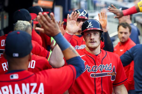 Atlanta Braves catcher Sean Murphy (12) celebrates a run scored during the first inning against the Houston Astros at Truist Park, Friday, April 21, 2023, in Atlanta. The Braves lost to the Astros 6-4. Jason Getz / Jason.Getz@ajc.com)
