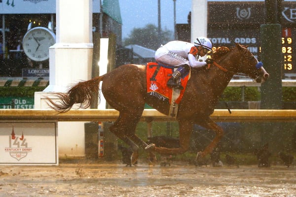 LOUISVILLE, KY - MAY 05:  Justify #7, ridden by jockey Mike Smith crosses the finish line to win the 144th running of the Kentucky Derby at Churchill Downs on May 5, 2018 in Louisville, Kentucky.  (Photo by Michael Reaves/Getty Images)