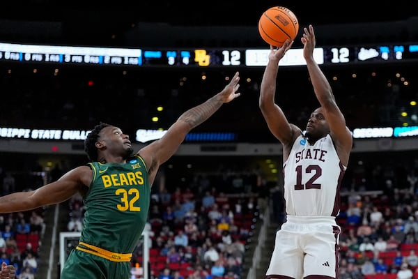 Mississippi State guard Josh Hubbard (12) shoots a three-point shot in front of Baylor guard Jalen Celestine (32) during the first half in the first round of the NCAA college basketball tournament, Friday, March 21, 2025, in Raleigh, N.C. (AP Photo/Stephanie Scarbrough)