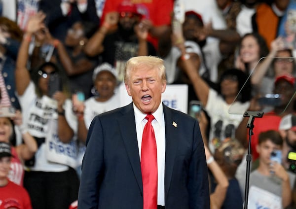 Former President Donald Trump reacts as he takes on the stage during a rally at the Georgia State University’s convocation center on Saturday, August 3, 2024 in Atlanta. Former President Donald Trump and Vice-Presidential candidate JD Vance are holding their first rally together in Georgia on Saturday at the same place – the GSU Convocation Center- Kamala Harris held hers earlier this week.  (Hyosub Shin / AJC)