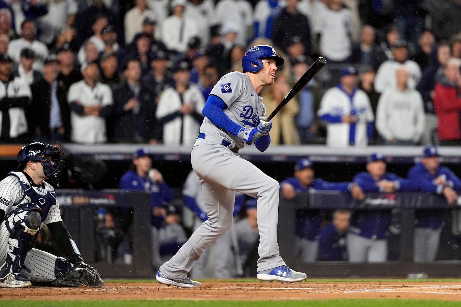 Los Angeles Dodgers' Freddie Freeman, right, watches his two-run home run against the New York Yankees during the first inning in Game 4 of the baseball World Series, Tuesday, Oct. 29, 2024, in New York. (AP Photo/Godofredo A. Vásquez)