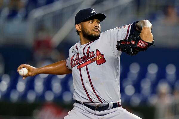 Atlanta Braves' Huascar Ynoa winds up during the first inning of the team's baseball game against the Miami Marlins, Tuesday, Aug. 17, 2021, in Miami. (AP Photo/Wilfredo Lee)