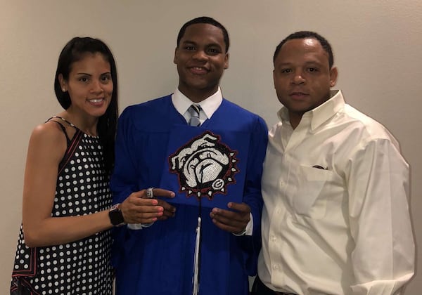 Georgia sophomore Sahvir Wheeler poses with his parents Jacqueline and Teddy Wheeler after graduating from Houston Christian in 2019. (Family photo)