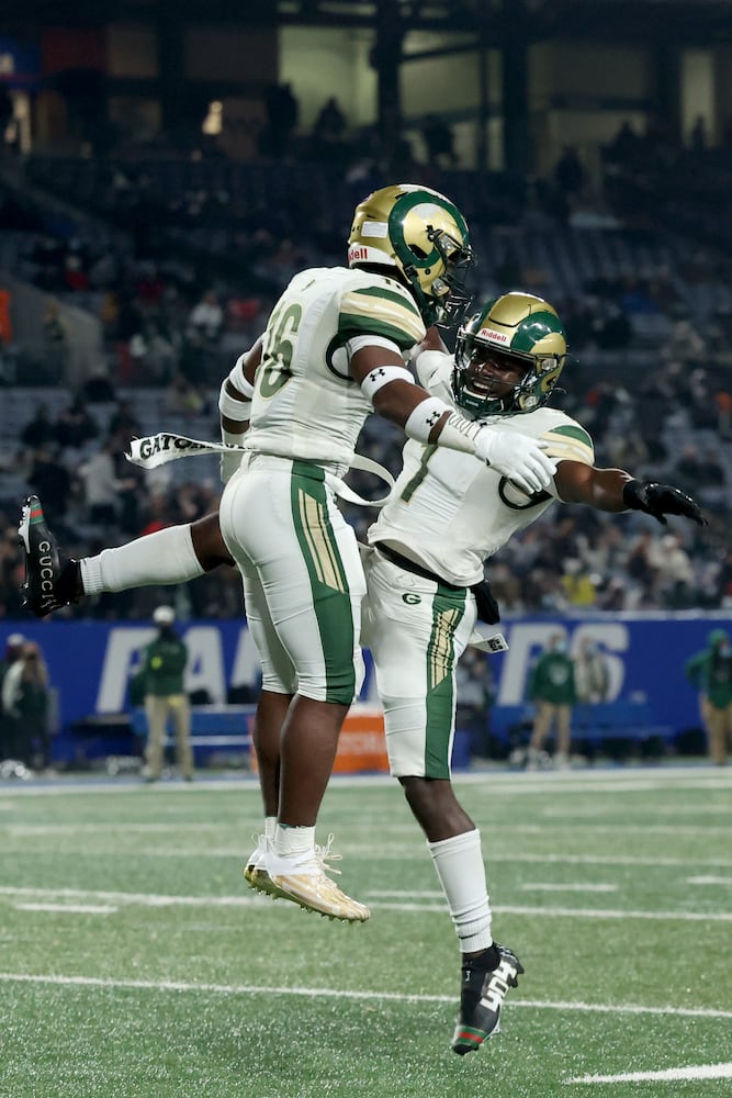 Dec. 30, 2020 - Atlanta, Ga: Grayson running back Jayvian Allen (16, left) celebrates a rushing touchdown with wide receiver Jamal Haynes in the first half against Collins Hill during the Class 7A state high school football final at Center Parc Stadium Wednesday, December 30, 2020 in Atlanta. JASON GETZ FOR THE ATLANTA JOURNAL-CONSTITUTION