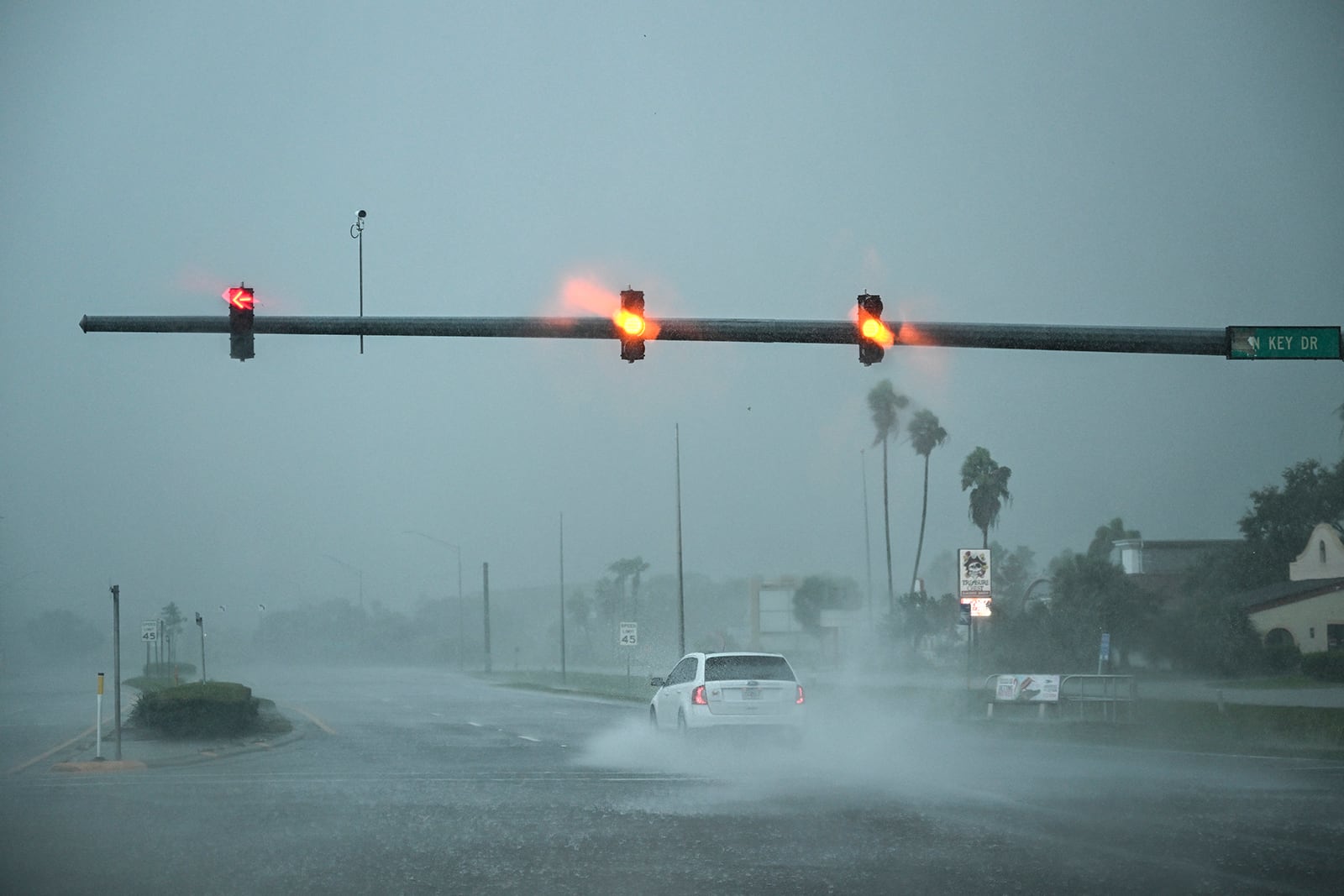 A car drives through the heavy rain in Fort Myers, Florida, on Oct. 9, 2024, as Hurricane Milton approaches. Milton regained power on Oct. 8 to become a Category 5 storm with maximum sustained winds of 165 mph (270 kph) as it barrels towards the west-central coast of Florida and is forecast to make landfall late Oct. 9, according to the National Hurricane Center. (Chandan Khanna/AFP via Getty Images/TNS)