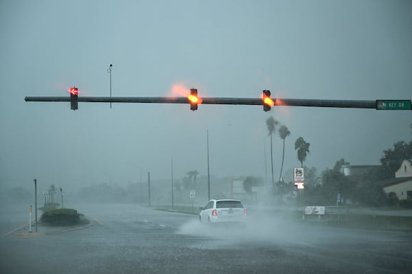 A car drives through the heavy rain in Fort Myers, Florida, on Oct. 9, 2024, as Hurricane Milton approaches. Milton regained power on Oct. 8 to become a Category 5 storm with maximum sustained winds of 165 mph (270 kph) as it barrels towards the west-central coast of Florida and is forecast to make landfall late Oct. 9, according to the National Hurricane Center. (Chandan Khanna/AFP via Getty Images/TNS)