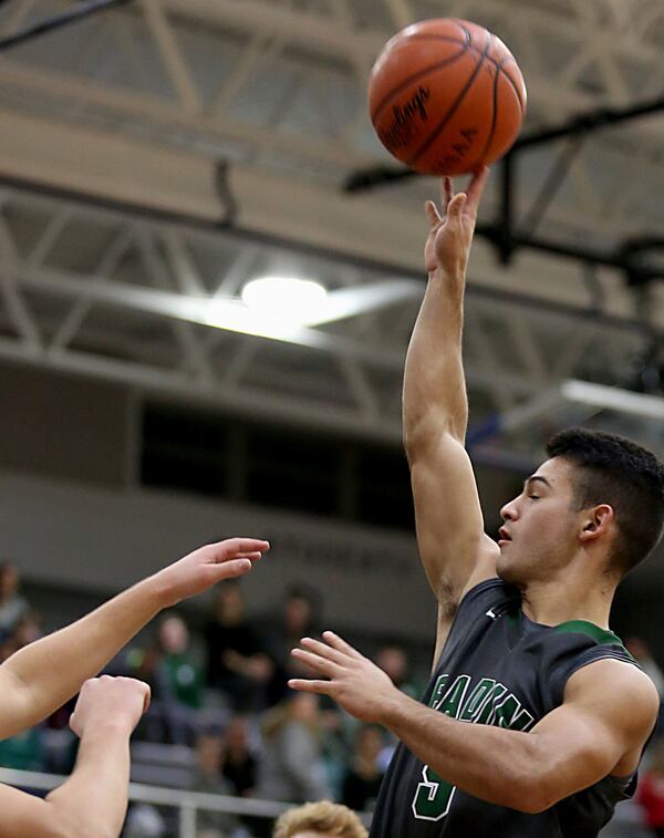 Badin guard Daunte DeCello elevates for two points against St. Xavier during Tuesday night’s game at Berning Gymnasium in Springfield Twp. CONTRIBUTED PHOTO BY E.L. HUBBARD