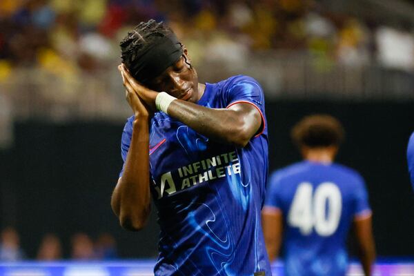 Chelsea FC midfielder Noni Madueke (11) imitates Club America fans before celebrating his team’s third goal on a penalty kick during the second half at Mercedes-Benz Stadium on Wednesday, July 31, 2024. Chelsea won 3-0.
(Miguel Martinez / AJC)