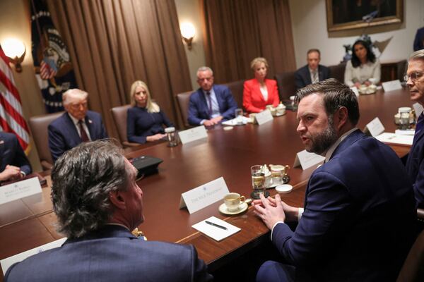 Vice President JD Vance, in foreground at right, speaks during a cabinet meeting at the White House in Washington, Monday, March 24, 2025. (Pool via AP)