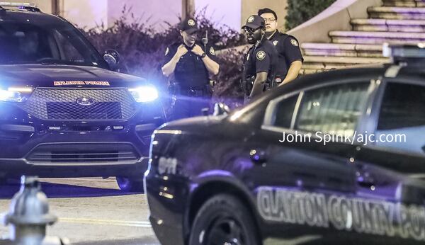 Atlanta police officers escorted the injured Clayton County officer to Grady Memorial Hospital on Friday morning.