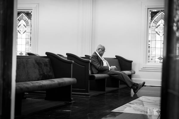 Willie Watkins waits in the chapel of his West End funeral home between services on Saturday, Nov. 11, 2023. (Arvin Temkar/AJC)