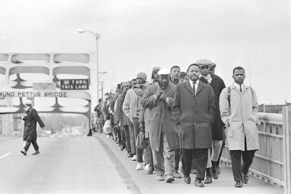 Hosea Williams and John Lewis lead marchers across the Edmund Pettus Bridge on March 7, 1965. They were met with state troopers and beaten in what became known as "Bloody Sunday." (Tom Lankford/The Birmingham News via AP)