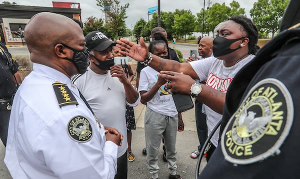 Protesters confront Interim Atlanta Police Chief Rodney Bryant on July 6, 2020, outside the Wendy's where Rayshard Brooks was killed by an Atlanta police officer. The City Council expanded the Atlanta Citizen Review Board's power to investigate all police shootings that same day in the wake of Brooks' death. (AJC 2020)