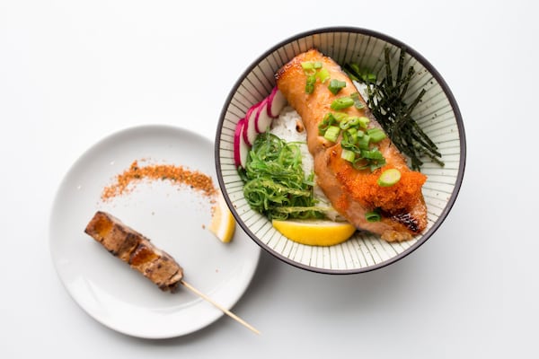 Miso Salmon Rice Bowl with seaweed, radish, lemon, and green onions. Photo credit- Mia Yakel.