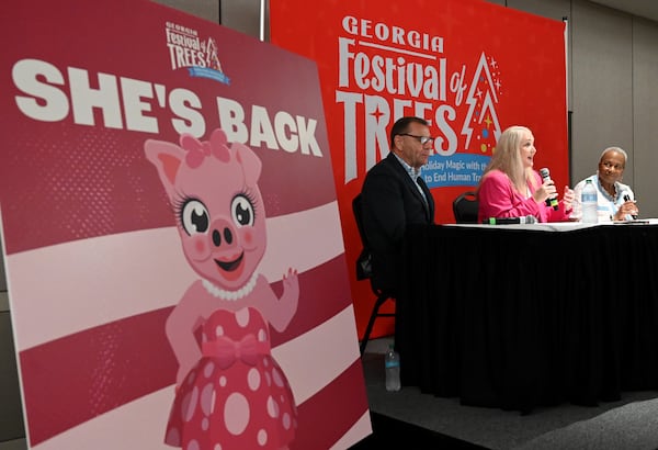 Stan Hall (left), CEO at Gas South District, and Angie Ulibarri, Executive Director of Georgia Festival of Trees, speak as Monica Pearson (right) moderates during a press conference reintroducing the Pink Pig, a ride that goes back to 1953 at Rich's department store and became an Atlanta tradition, at Gas South Conference Center on Saturday, July 27, 2024, in Duluth. (Hyosub Shin / AJC)