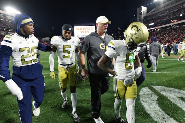 Georgia Tech head coach Brent Key and players leave the football field after Georgia won 44-42 over Georgia Tech in eight overtimes during an NCAA football game at Sanford Stadium, Friday, November 29, 2024, in Athens. (Hyosub Shin / AJC)