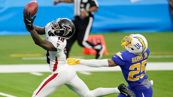 Atlanta Falcons wide receiver Calvin Ridley (18) catches a touchdown pass from wide receiver Russell Gage in front of Los Angeles Chargers cornerback Chris Harris Jr. during the first half Sunday, Dec. 13, 2020, in Inglewood, Calif. (Ashley Landis/AP)