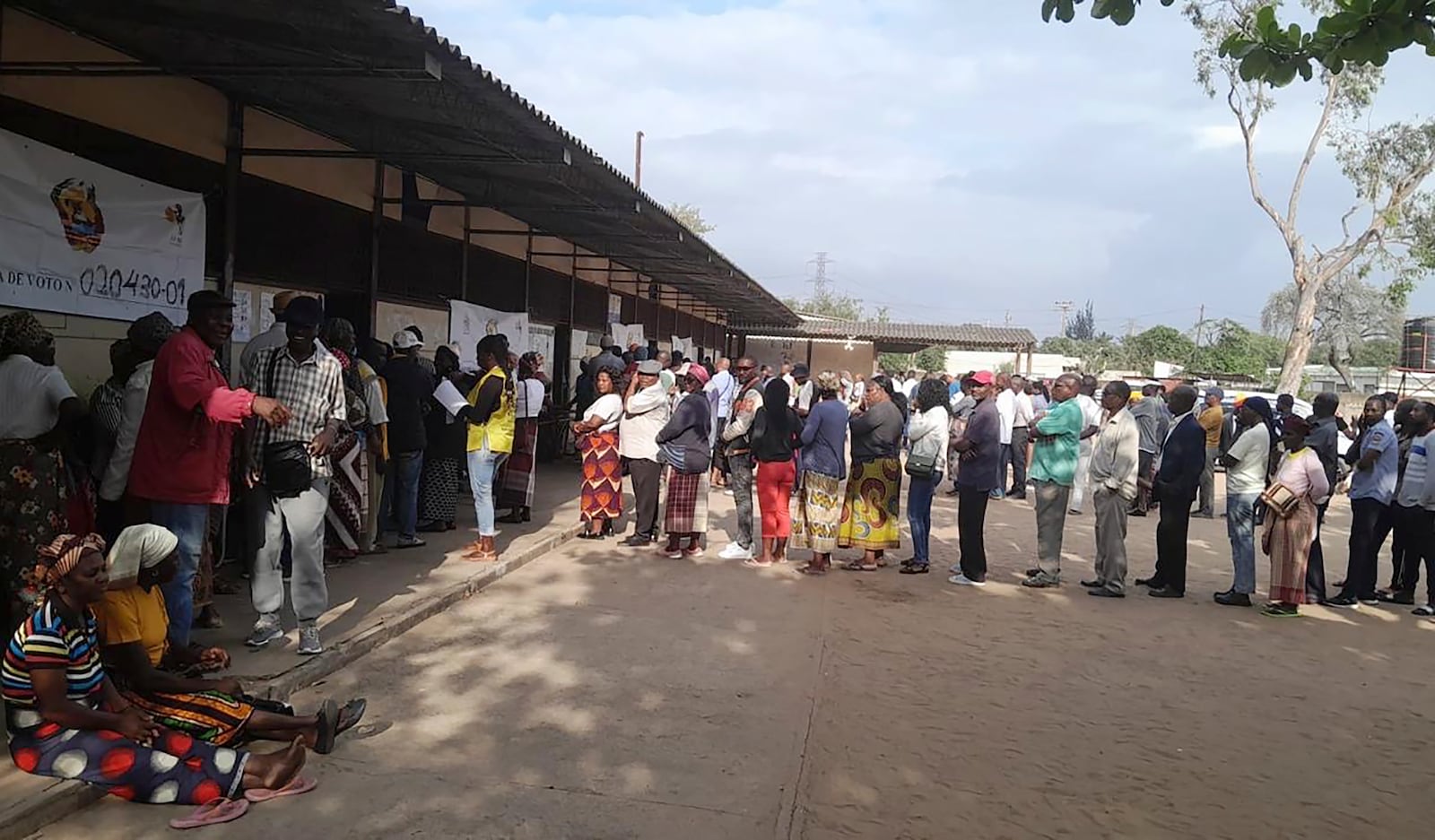 People queue to cast their votes during the general elections in Maputo, Mozambique, Wednesday, Oct. 9, 2024. (AP Photo/Charles Mangwiro)