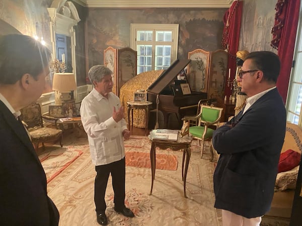 José Pérez (center) speaks with film star Andy Garcia (right) during the dedication of the statue of José Martí at the Millennium Gate Museum in Midtown Atlanta. Musician Enrique Chia is at the left. (Courtesy of José Pérez)