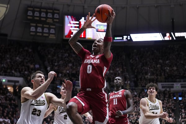 Alabama guard Labaron Philon (0) shoots over Purdue forward Camden Heide (23) during the first half of an NCAA college basketball game in West Lafayette, Ind., Friday, Nov. 15, 2024. (AP Photo/Michael Conroy)