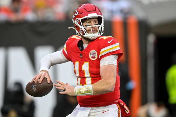 Kansas City Chiefs quarterback Carson Wentz (11) passes in the pocket against the Cleveland Browns during the second half of an NFL football game, Sunday, Dec. 15, 2024, in Cleveland. (AP Photo/David Richard)