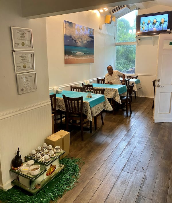 Woinshet Legesse Emory displays her culinary degrees above an Ethiopian coffee service at her Clarkston restaurant, Chef Winnie’s Kitchen. Wendell Brock for The Atlanta Journal-Constitution