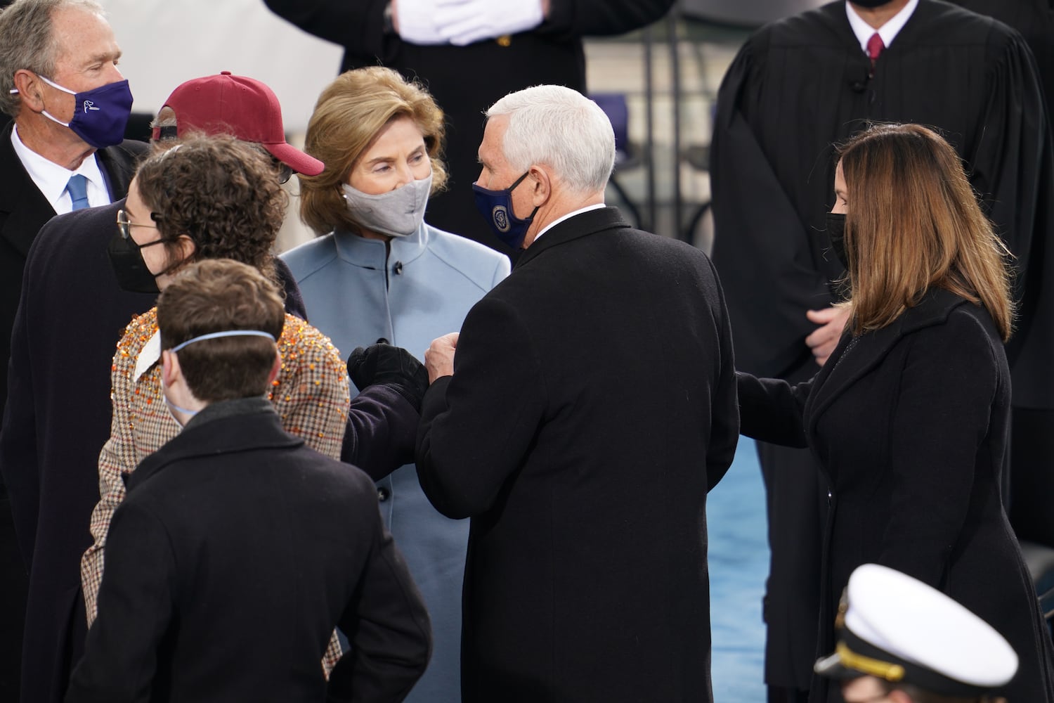 Former President George W. Bush, top left, his wife Laura Bush, Vice President Mike Pence and his wife Karen Pence at the Capitol in Washington on Wednesday, Jan. 20, 2021, ahead of the inauguration President-elect Joe Biden. (Ruth Fremson/The New York)