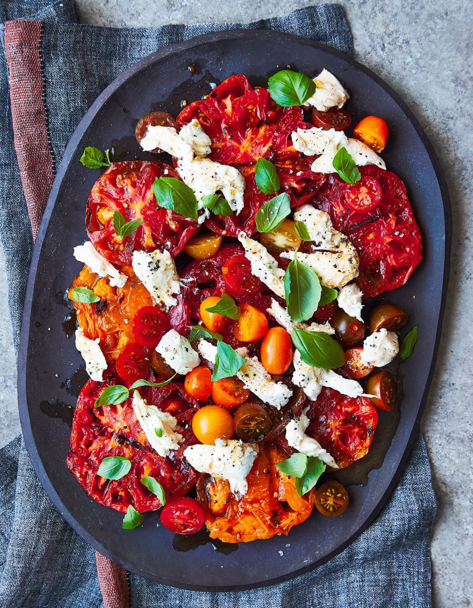 The key to Grilled Heirloom Caprese Salad is to have thick slices of tomatoes and just char them. This recipe is adapted from “Serial Griller” by Matt Moore. CONTRIBUTED BY ANDREA BEHRENDS AND HELENE DUJARDIN