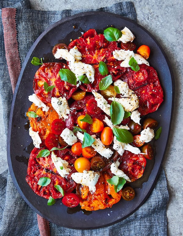 The key to Grilled Heirloom Caprese Salad is to have thick slices of tomatoes and just char them. This recipe is adapted from “Serial Griller” by Matt Moore. CONTRIBUTED BY ANDREA BEHRENDS AND HELENE DUJARDIN