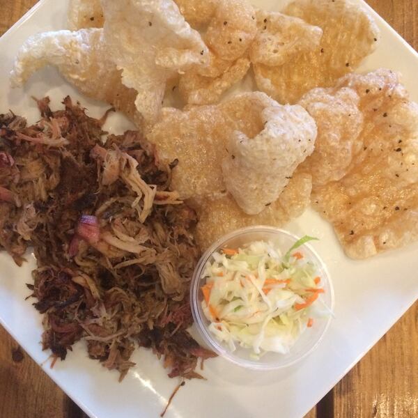 Catfish Hox smokes barbecue pork on a Big Green Egg and fries pork rinds to order. The skins are still crackling when they arrive at the table. CONTRIBUTED BY WENDELL BROCK