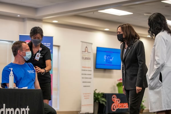 Vice President Kamala Harris talk to man receiving a COVID-19 vaccination shot during a visit to a pop-up vaccination site at Ebenezer Baptist Church in Atlanta.(Alyssa Pointer / Alyssa.Pointer@ajc.com)