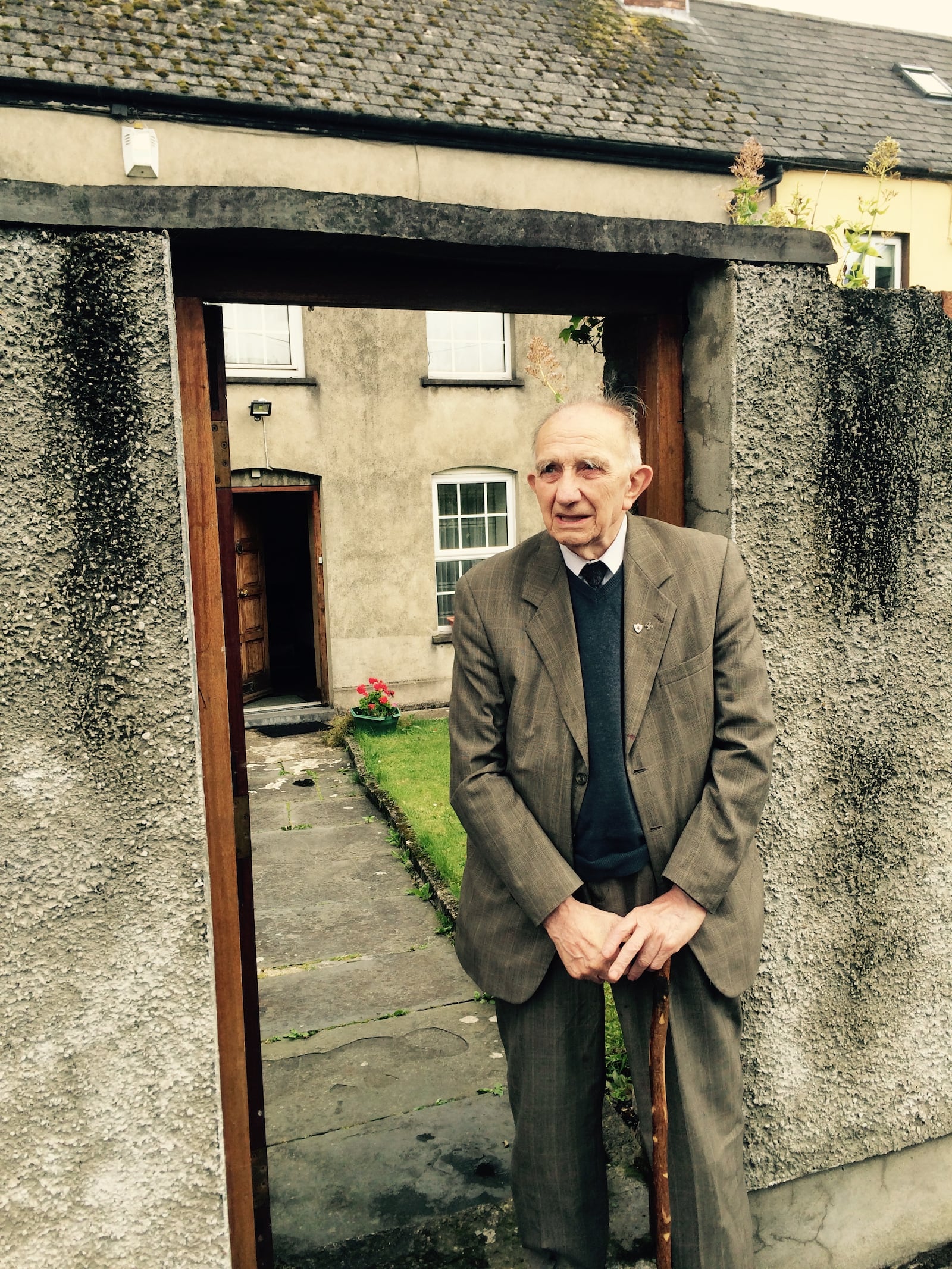 Joe Gilligan at the gate of Peters Cell, where he lived for nearly a century. Courtesy of Bill Torpy