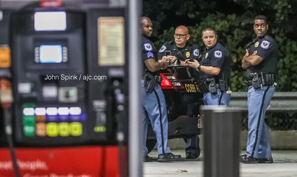 Cobb County and Fulton County police responded to the RaceTrac, which was temporarily blocked off with crime scene tape.